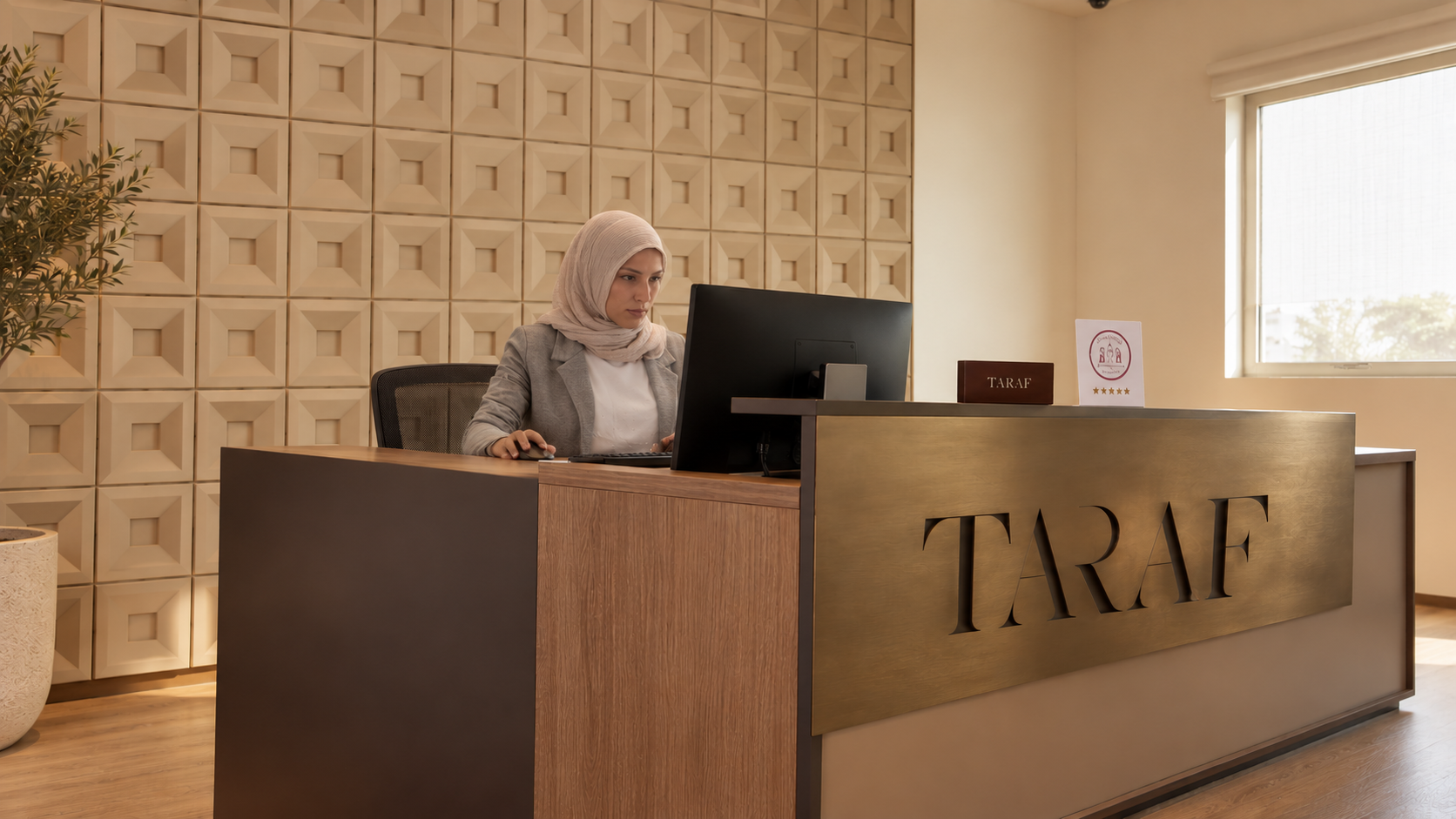 TARAF reception desk with the office name in brass lettering